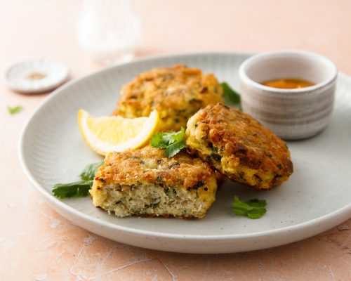 Traditional homemade fish cakes with tomato sauce